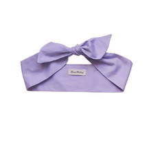 Load image into Gallery viewer, Lilac headband with a bow on a white background
