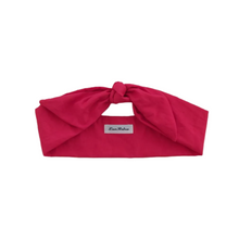 Load image into Gallery viewer, Red headband with a brand label on a white background