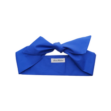 Load image into Gallery viewer, Royal blue headband with a bow on a white background