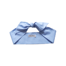 Load image into Gallery viewer, Light blue headband with a bow on a white background