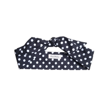 Load image into Gallery viewer, Black headband with white polka dots on a white background