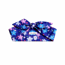 Load image into Gallery viewer, Blue floral headband with a bow and a LanRetro label on a white background