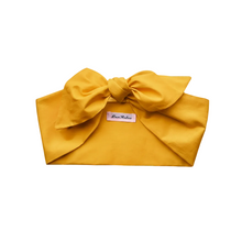 Load image into Gallery viewer, Golden yellow headband with a large bow on a white background