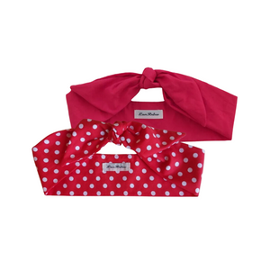 Two red coloured hair scarves, one solid red and the other with a red and white polka dot pattern, displayed on a neutral background.