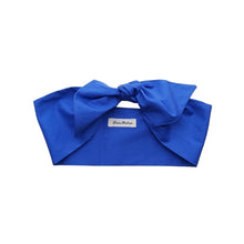 Load image into Gallery viewer, A royal blue cotton hair scarf displayed on a flat surface with a brand tag visible.
