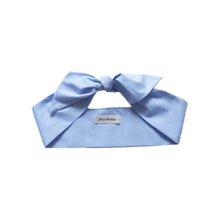Load image into Gallery viewer, Sky blue hair scarf with a large bow and a label at the center, designed for versatile styling.