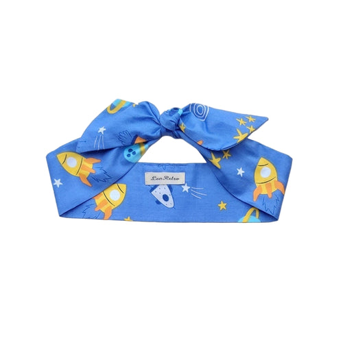 A blue cotton hair scarf with a space rockets print, displayed on a neutral background.