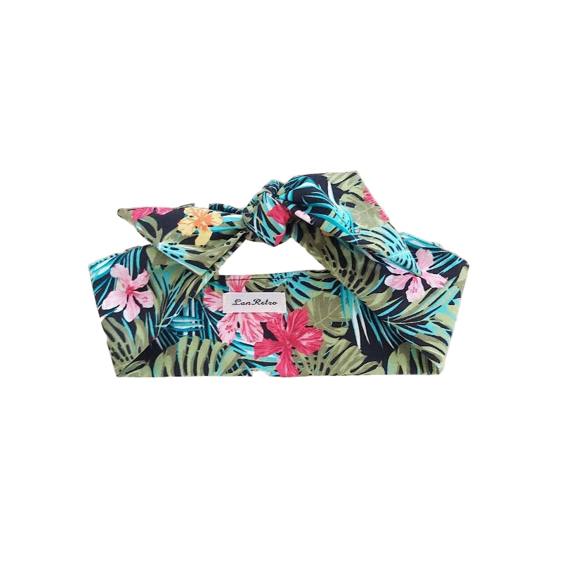 A multicolored cotton tropical print hair scarf tied in a knot, displayed on a neutral background.