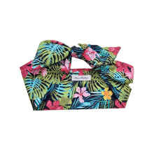 Load image into Gallery viewer, A multicolored cotton tropical print hair scarf tied in a knot, displayed on a neutral background.